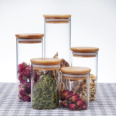 China Custom Size Eco-friendly Yes Handmade Cylinder Storage Jar Glass Cookie Candy Jar With Lid for sale