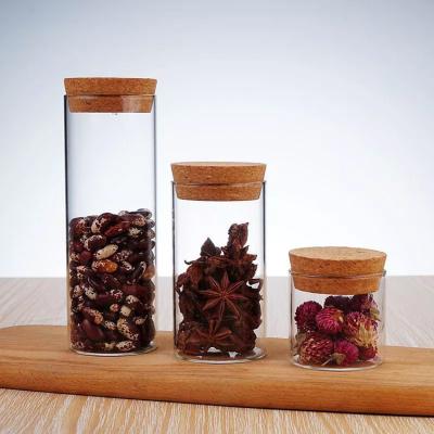 China Custom heat resistant clear glass candy nut storage size spice logo glass canisters with cork for sale