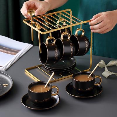 China New Product Viable Modern Black Ceramic Arabic Coffee Cups And Saucers English Afternoon Tea Cup Set With Luxury Gold Stand And Spoon for sale