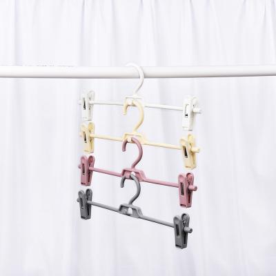 China Wholesale Wide Universal Magic Space Saving Plastic Shoulder Hangers Non-trace Display Pants Racks for sale