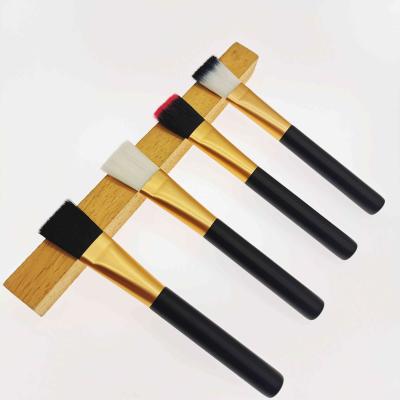 China Angular blush cheap and high quality four-color coating beauty black wooden handle mask brush for sale