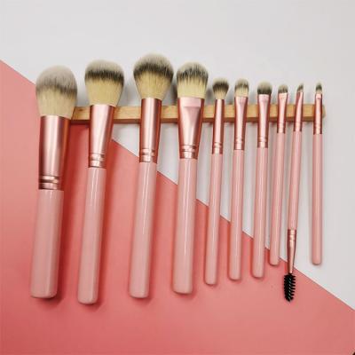 China Angular Blush Professional Customized 10 Pieces Matte Pink Wooden Handle Makeup Cosmetic Brush Set Tools for sale