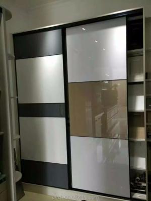 China Wardrobe UV Acrylic Melamine Bedroom Wardrobe PVC Wooden Door Designs for sale