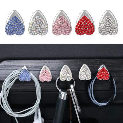 China Creative And Practical Cute Diamond-encrusted Small Car Bling Hold Ware Seat Instrument Car Hanger Backseat Accessories For Women Girl for sale