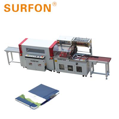 China Book High Speed ​​Side Exercise CLOTHING Shrink Wrapping Sealing Packaging Machine for sale