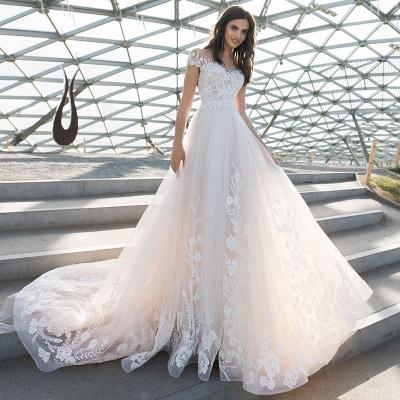 China Anti-Static Custom Illusion O-Neck Cap Sleeve Wedding Dress Light Champagne Beading Lace Wedding Dress for sale