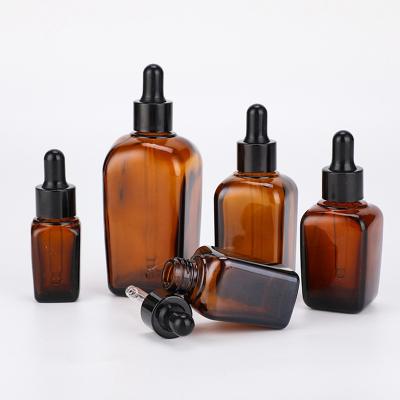 China Cosmetic In Stock Cosmetic Packaging Sloping Shoulder Amber Glass Essential Oil Bottle Container For Hair Body Skin Care With Dropper for sale