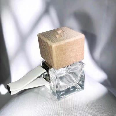 China 5ml 8ml Cosmetic Empty Square Car Vent Clip Bottle Glass Car Air Freshener Ornament Glass Perfume Bottles With Vent Clip And Sticks for sale