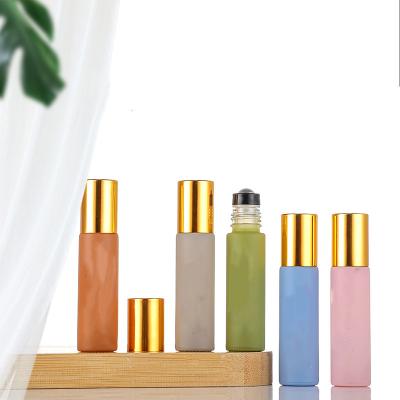 China Low MOQ Cosmetic in 5ml 10ml Color Mini Essential Oil Perfume Roll-On Glass Roll-on Custom Bottle with Roll Ball and Aluminum Cap for sale