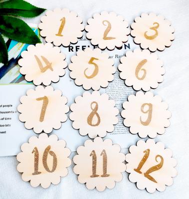 China Europe 12 Laser Cut Pregnancy Announcement Newborn Photo Props Wooden Blocks Card Discs Baby Age Monthly Milestone for sale