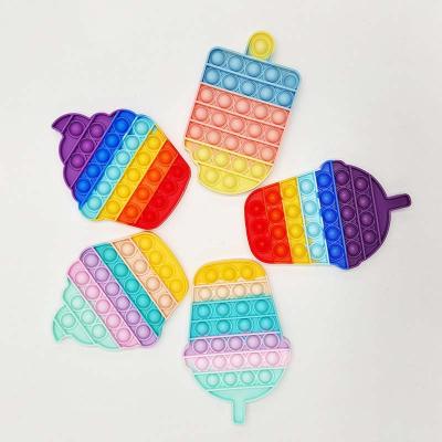 China Popular Fashion REWIN Rainbow Ice Cream Shape Silicone Pushing Bubble Noise Anti Stress Toy for Kids Gift for sale