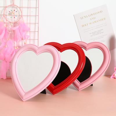 China 2022 Minimalist Heart Shaped Desktop Wall Mirror Small Makeup Mirror Bedroom Mirror for sale