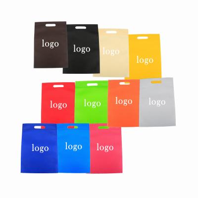 China Nonwoven Material & Style Die Cut Handle Reusable Custom Logo Foldable Non Woven Handled Fair D Cut Bag for sale