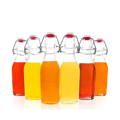 China Wholesale 250ml 500ml 1000ml Eco-friendly Recyclable Clear Wine Liqure Glass Swing Top Bottles for sale