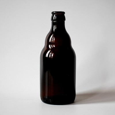 China Beverage Free Samples Amber Transparent Dark Glass Beer Bottle With Lid For Bar Restaurant Party for sale