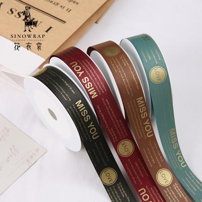 China New Printed English Alphabet Printing Florist Supplies Double Sided Embossed Plastic Tape for sale