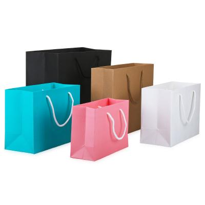 China Recyclable Cheap Foldable Goods Recyclable White Kraft Paper Shopping Bag With Handle for sale