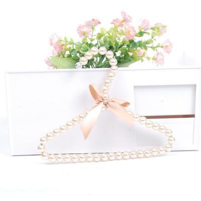 China Viable Hot Selling Pet Necessities Butterfly Pet Clothes Hanger Dog Bead Daily Pet Clothing Hanger Plastic Hanger for sale