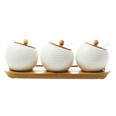 China Sustainable Ceramic White Bulk Spice Jar With Bamboo Tray Set Of 3 for sale