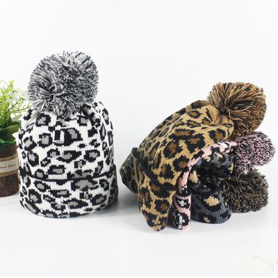 China COMMON Hats Winter Pom Pom Beanie Leopard Print Fashion Warm Slouchy Skull Cap For Women for sale