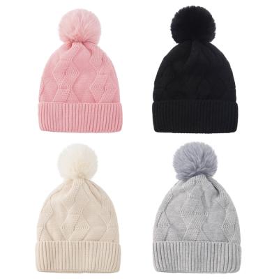 China 2021 Winter COMMON Beanie Hats Furry Fur Pompom Warm Acrylic Knitted Beanie Cap For Women for sale