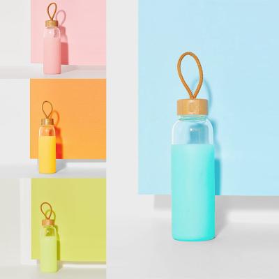 China WITH LID bottle gift set eco-friendly bamboo lid silicone cover simple glass water bottle with non slip silicone sleeve for sale