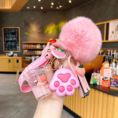 China Creative Liquid Keychain Crystal Milk Keychain Cute Hairy Milk Bottle Ball Flow Computer Nail Key Chain Bag Pendant for sale