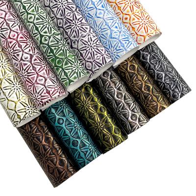 China Waterproof Vintage Embossed Snowflake Textured Crafts Fabric Faux Metallic Distressed Leather For Upholstery Crafts Sewing Bags for sale