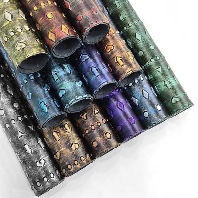 China Heart Arrow Pattern Faux Leather Roll Waterproof Vintage Embossed Metallic Synthetic Fabric For Upholstery Sewing Craft Bags Garment Making for sale