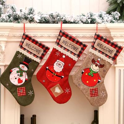 China Polyester Christmas Stocking Decorations Christmas Stocking Ornaments Kids Xmas Eve Gift Bag Decoration for sale