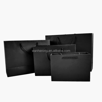 China Boutique Shopping Recyclable Paper Bags For Boots Shoes With Black Ribbon Handle for sale