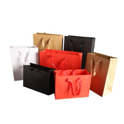 China Recyclable Custom Clothing Jewelry Gift Medium Cardboard Paper Bag Printed With Logo for sale