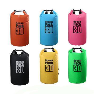 China Custom Logo 250D-500D PVC or Polyester Fabrics PVC Waterproof Dry Bag Cylinder Office Compression Dry Bag Swimming Floating Dry Bags for sale