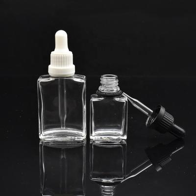 China 15ml 30ml Cosmetic Bottle Square Glass Rectangle Cosmetic Glass Dropper Bottle With Dropper Cap For Essential Oil for sale