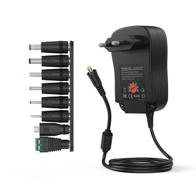 China Multiple Ports 12V Power Adapter 3v 4.5v 6v 7.5v 9v 12v 1a 2a AC Adapter 85*55*34mm for sale