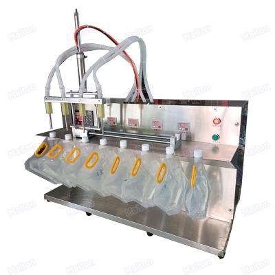 China Food Good Quality 4 Head Semi-automatic Cloth Remover Spout Pouch Bag Liquid Filling And Capping Machine for sale