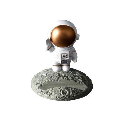 China Simple Funny Europe Idea Gift Resin Figurine Astronaut Student iPad Stand Cell Phone Holders for sale