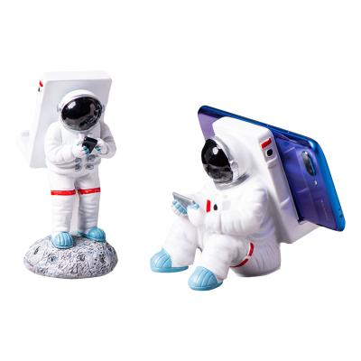 China Europe Resin Figure Astronaut Mobile Phone Holders for sale