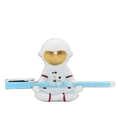 China Fantasy Astronaut Moon Rocket Figurine Decorative Pencil Holder from Europe Resin Craft for sale