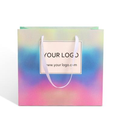 China Customized logo BIODEGRADABLE holographic cardboard paper packaging carry shopping bag with rope handle for sale