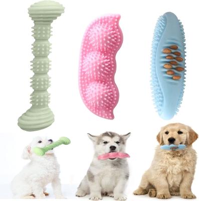 China Durable Puppy Tpr Leaked Food Treats Forming Hard Toothbrush Stick Chewing Molar Chew Cleaning Teeth Bite Dog Pet Toys for sale