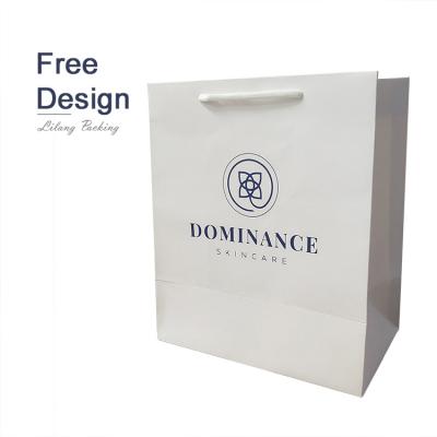 China 2022 Recyclable Wholesale Custom Paper Bags White Paper Gift Packaging Bags High Quality Clothing Paper Bag With Logo Print for sale