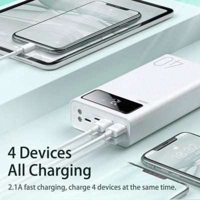 China Fast Charge Really 40000 Mah Power Bank Polymer With 4 Usb Support Remax RPP-113 Ports High Capacity Powerbank 40000 mah for sale