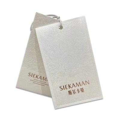 China Other Luxury Hangtag Supplier Custom UV Printed Logo  White Paper Custom Clothes Hang Tags for sale