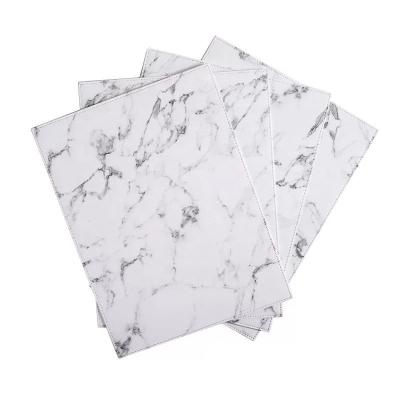 China Sustainable customizable LOGO marbled waterproof leather place mat and oilproof insulation place mat for sale