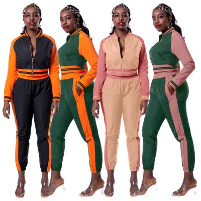 China Breathable Overall Woman Autumn Color Matching Casual Hooded Sports Striped Jogging Two Piece Set for sale