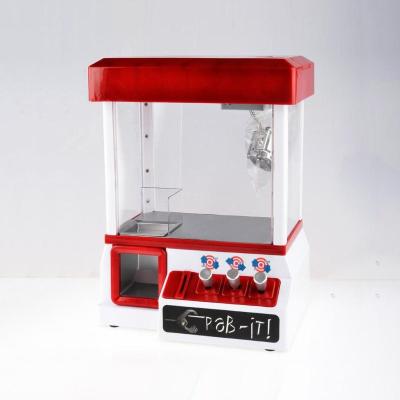 China Cartoon Toys Candy Grabber, Coin Operated Doll Candy Catcher Desk Crane Grab-IT Machine Red Cartoon Toys Candy Soft Plastic for sale