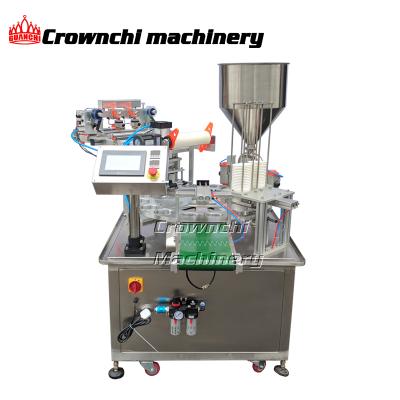 China Rotary Plastic Food Cup Container Filling And Sealing Machine For Yogurt Milk Filling for sale