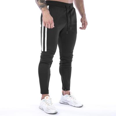 China Custom Stylish Men's Breathable Outdoor Fitness Loose Comfortable Sports Running Pants for sale