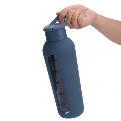 China 750ml minimalist manufacturer customized drinking glass bpa free water bottles with silicone sleeve and packing for sale